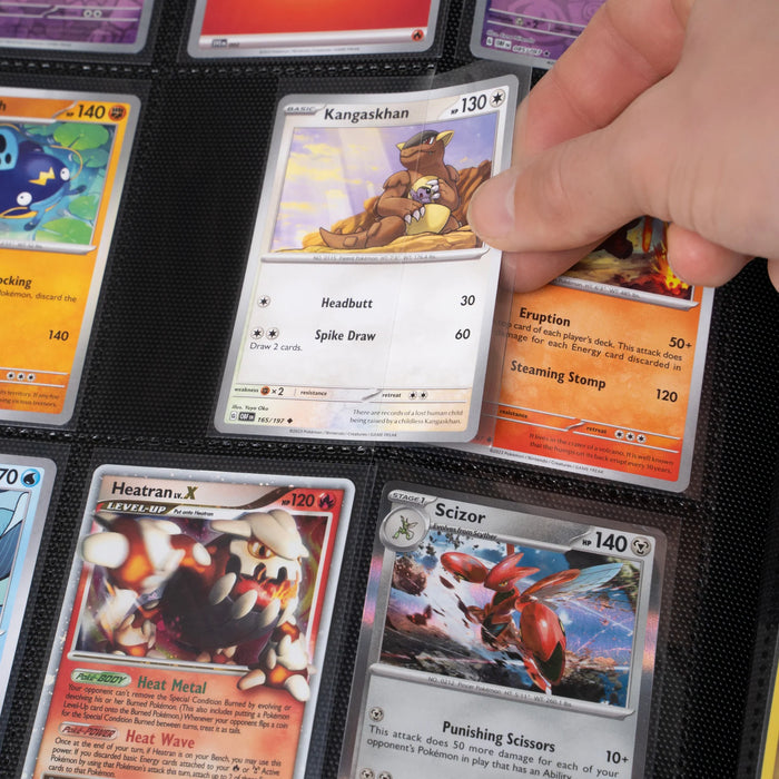 A hand holds a Kangaskhan Pokémon card above a Gemloader: Premium Samlekortmappe [1024 pockets 4X4] with organized Pokémon cards, such as Scizor and Heatran LV.X, all securely stored in protective sleeves by Gemloader.