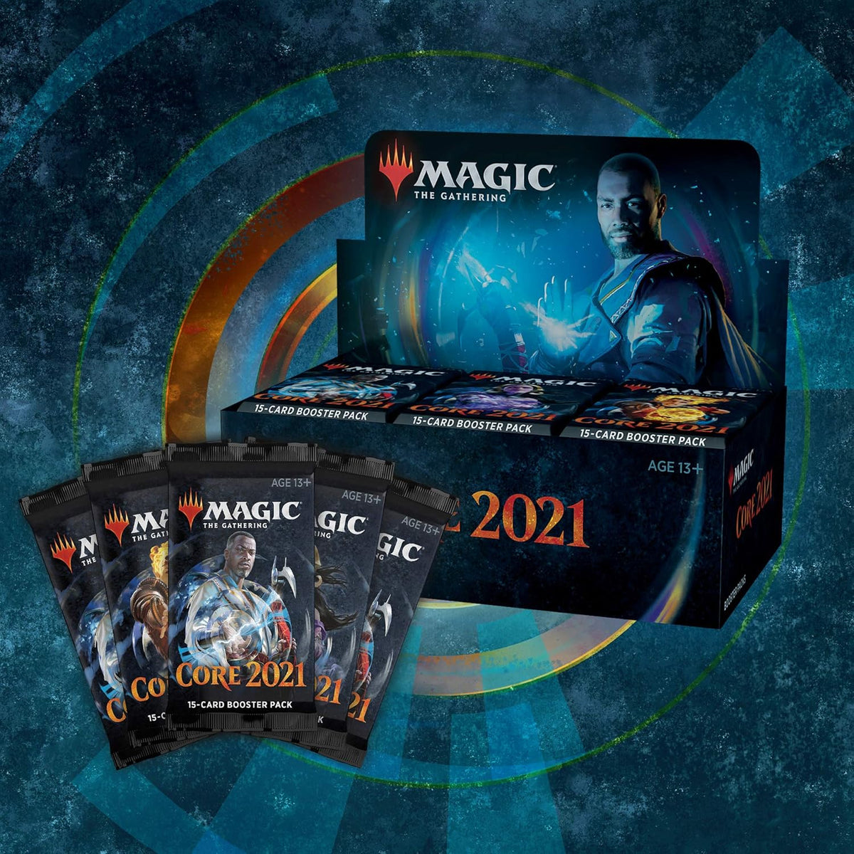 The Wizards of the Coast Magic the Gathering: Core Set 2021 Booster Display features a blue-armored, glowing-magic character and displays “Core 2021” and “Booster Packs” text on the box.