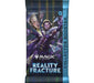 A Magic: The Gathering – Reality Fracture Collector Booster pack from the Wizards of the Coast Reality Fracture Collector Booster Display showcases striking fantasy character art with a shattered glass motif on the packaging. Intended for ages 13 and up, each pack includes 15 cards.