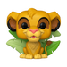 A Funko POP! Disney: Simba - #1733 vinyl figure by Funko features a young lion with large eyes, tan fur, and big ears sitting in front of green leaves, capturing the iconic cartoon look.