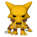 A yellow, cartoon-style creature with large pointed ears, brown armor, and holding two white spoons is featured as the Funko POP! Pokemon: Alakazam #855 collectible from Funko, Inc.—an ideal addition to any Pokémon merchandise collection.