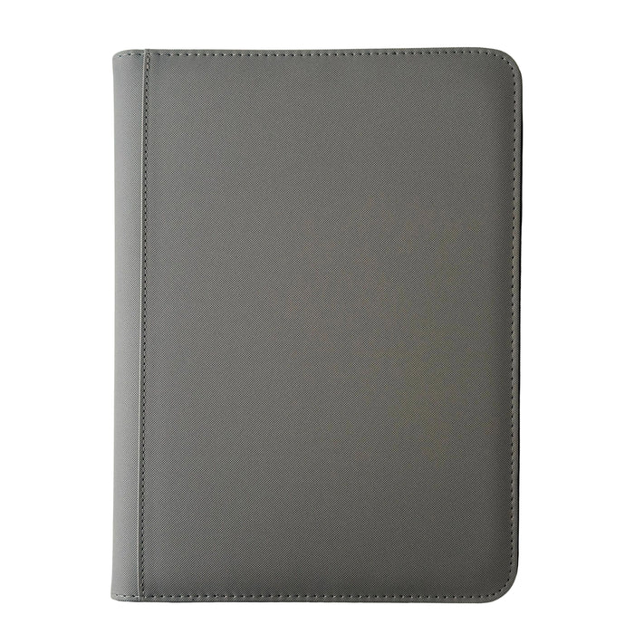 A closed TCGPicks: Samlekortmappe [360 pockets 3X3] by Ml Trading, featuring a gray textured cover with visible stitching and rounded corners, is placed on a white surface.