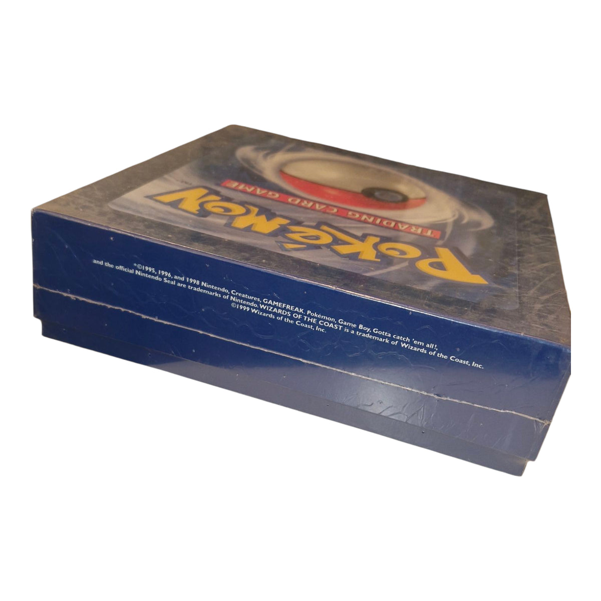 A factory sealed Pokémon 1999 Promotional Press Kit by The Pokémon Company, featuring a classic gift box with Poké Ball design and Pokémon logo on a blue background.
