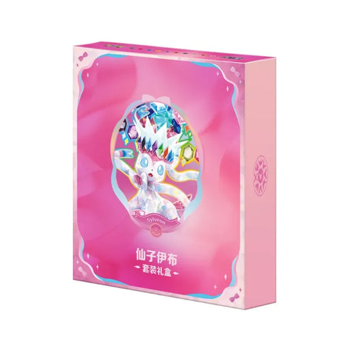 A soft pastel gift box from The Pokémon Company, the “Pokemon Sylveon Terastal Grand Crystal Gathering Simplified Chinese Binder Gift Box” features Sylveon adorned with crystal accents and colorful jewels, set above Chinese characters. The design includes scalloped edges and a logo on the side.