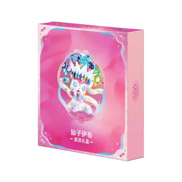 A soft pastel gift box from The Pokémon Company, the “Pokemon Sylveon Terastal Grand Crystal Gathering Simplified Chinese Binder Gift Box” features Sylveon adorned with crystal accents and colorful jewels, set above Chinese characters. The design includes scalloped edges and a logo on the side.
