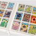 The Gemloader: Premium Samlekortmappe [360 pockets 3X3] neatly organizes Pokémon trading cards in plastic sleeves, displaying colorful characters, trainers, and energy cards for optimal samlekort opbevaring.