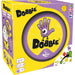 Yellow box of Asmodee’s Dobble vendekortspil, featuring a purple tin with a cartoon hand, game logo, and icons for 2-8 players, ages 6+, and 15-minute playtime. Flags indicate multiple languages.