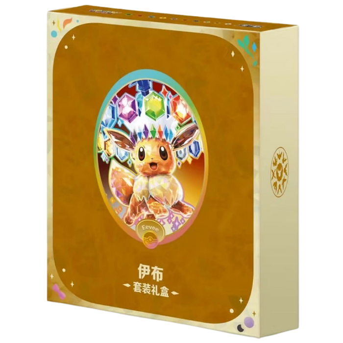 A golden gift box from The Pokémon Company, called the Pokemon Eevee Terastal Grand Crystal Gathering Simplified Chinese Binder Gift Box, features an illustration of Eevee adorned with crystal decorations and multicolored gems above its head. The front displays Chinese text, while the Pokémon logo is shown on the side.