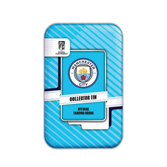 A rectangular tin with blue stripes from Topps, featuring the Manchester City FC logo, labeled “Topps Collector Tin 2026/27 Manchester City” and “Official Trading Cards.”.