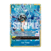 The One Piece Card Game: Premium Card Collection -Best Selection Vol.6 by Bandai includes a trading card titled Ice Time that showcases a character surrounded by ice shards in water, with highlighted stats and detailed text describing in-game actions and effects.