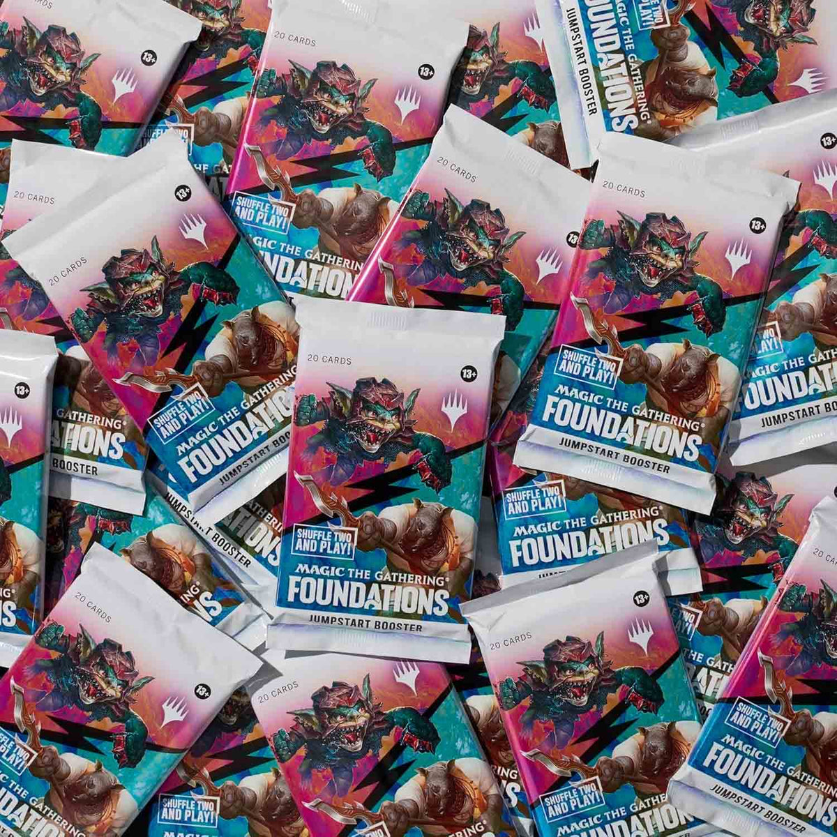 Several Wizards of the Coast Magic the Gathering: Foundations Jumpstart Booster Packs are spread out and overlapping, each showcasing vibrant artwork with a fierce creature.