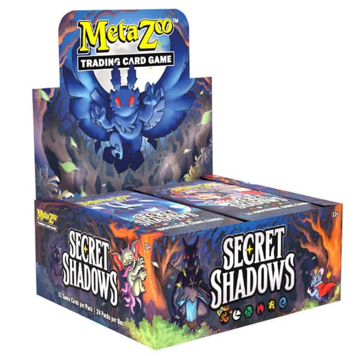 A MetaZoo TCG: Secret Shadows Booster Box featuring a monster display on the lid and illustrations of creatures on the front panels.