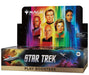 A Wizards of the Coast Magic: The Gathering – Star Trek Play Booster Display from the Universes Beyond series, showcasing portraits of iconic Star Trek characters set against a vibrant backdrop with a starship and planets below.