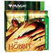 The Wizards of the Coast Magic the Gathering: The Hobbit Collector Booster Display features green and gold packaging adorned with artwork of a dragon and a small figure. Designed for ages 13 and up, this display box showcases The Hobbit theme on its collector boosters.